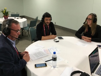 Bobby Farahi (center) records a podcast episode with co-hosts Nicole Reyhle (right) and Bill Thorne (left).